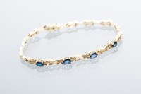 Lot 2023 - SAPPHIRE AND DIAMOND BRACELET set with four...