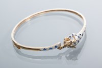 Lot 2024 - SAPPHIRE AND DIAMOND PANTHER BANGLE pave set...