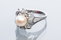 Lot 2028 - PEARL AND DIAMOND DRESS RING with a central...