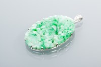 Lot 2069 - FINE JADEITE AND DIAMOND PENDANT with a carved...