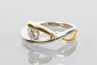 Lot 2090 - DIAMOND SINGLE STONE RING of crossover design,...
