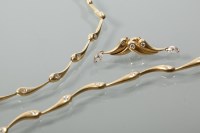 Lot 2125 - SUITE OF GOLD AND DIAMOND JEWELLERY comprising...