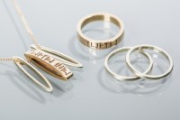 Lot 2132 - ORTAK NINE CARAT GOLD PENDANT AND THREE RING...