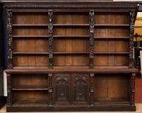 Lot 791 - TWO VICTORIAN MATCHING CARVED OAK BOOKCASES...