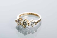 Lot 2148 - DIAMOND THREE STONE RING the central brilliant...