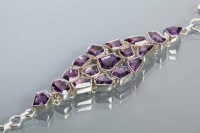 Lot 2170 - UNUSUAL AMETHYST BRACELET of graduated design,...
