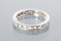 Lot 1627 - ART DECO DIAMOND ETERNITY RING with engraving...