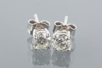 Lot 1635 - PAIR OF DIAMOND STUD EARRINGS each set with a...