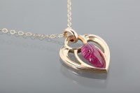 Lot 1636 - RUBY PENDANT ON CHAIN the heart shaped pendant...