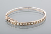 Lot 1642 - EARLY TWENTIETH CENTURY PEARL SET BANGLE set...