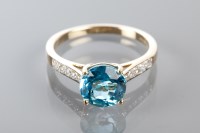 Lot 1650A - TOPAZ AND DIAMOND RING the round blue topaz...