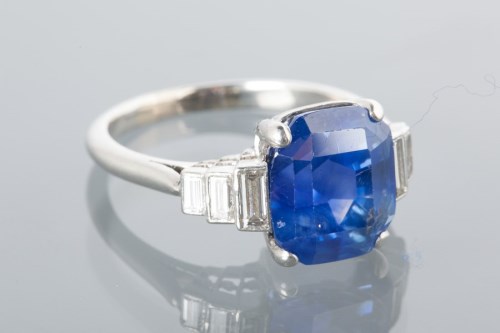 Lot 1659 - SAPPHIRE AND DIAMOND DRESS RING with a large...