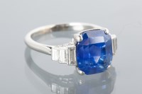 Lot 1659 - SAPPHIRE AND DIAMOND DRESS RING with a large...