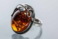 Lot 2175 - BALTIC AMBER DRESS RING set with an oval...