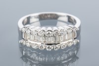 Lot 1672 - THREE ROW DIAMOND RING set with a row of...