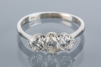 Lot 1681 - DIAMOND THREE STONE RING the central marquise...