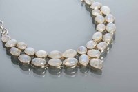 Lot 2178 - MOONSTONE NECKLET set with two rows of oval,...
