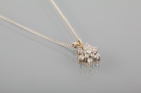 Lot 1700A - DIAMOND CLUSTER PENDANT set with a floral...