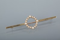 Lot 1708 - FIFTEEN CARAT GOLD SEED PEARL SET BAR BROOCH c....