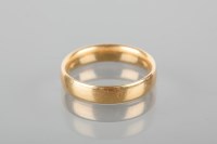 Lot 1713 - EIGHTEEN CARAT GOLD WEDDING BAND with full...