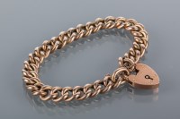 Lot 1718 - NINE CARAT GOLD CURB LINK BRACELET with a...