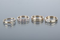 Lot 1720 - GROUP OF FOUR GOLD RINGS comprising a diamond...