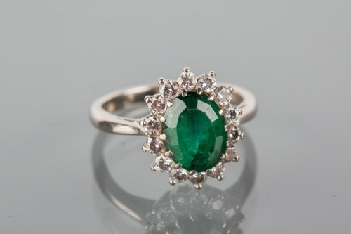 Lot 1726 - GREEN GEM AND DIAMOND CLUSTER RING set with a...