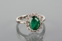 Lot 1726A - GREEN GEM AND DIAMOND CLUSTER RING set with a...