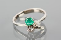 Lot 1727 - EMERALD AND DIAMOND RING of floral design, set...