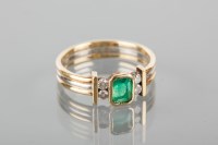 Lot 1728A - EMERALD AND DIAMOND RING set with a central...