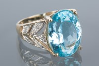 Lot 1732 - TOPAZ DRESS RING the large oval topaz 16x12mm,...