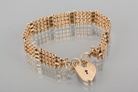 Lot 1741A - NINE CARAT GOLD GATE LINK BRACELET with a...