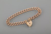 Lot 1744A - CURBLINK BRACELET with a heart shaped clasp,...