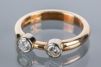 Lot 1760 - DIAMOND TWO STONE RING in fourteen carat gold