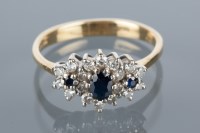 Lot 1763 - SAPPHIRE AND DIAMOND CLUSTER RING set with a...