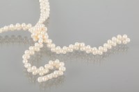 Lot 1791 - FRESHWATER PEARL NECKLACE formed by three rows...