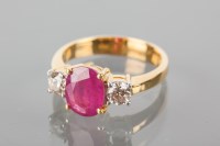 Lot 1792A - RUBY AND DIAMOND THREE STONE RING the central...