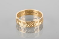 Lot 1796 - EIGHTEEN CARAT GOLD WEDDING BAND with engraved...