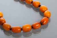 Lot 2198 - BUTTERSCOTCH AMBER BEAD NECKLACE formed of...