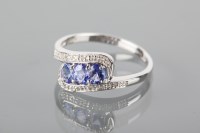 Lot 1810 - TANZANITE AND DIAMOND DRESS RING set with...