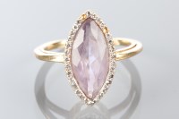 Lot 1810A - AMETHYST AND DIAMOND RING the central marquise...