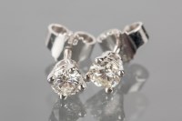 Lot 1813 - PAIR OF DIAMOND STUD EARRINGS each set with a...