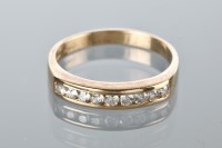 Lot 1819A - DIAMOND HALF ETERNITY RING channel set with...