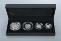 Lot 1527 - THREE THE BRITANNIA FOUR-COIN SILVER PROOF...