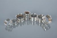 Lot 336 - GROUP OF SEVEN SILVER NAPKIN RINGS including a...