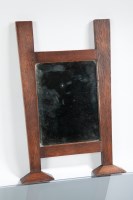 Lot 825 - ARTS AND CRAFTS OAK WALL MIRROR of square form...