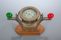 Lot 832 - 20TH CENTURY DESK MODEL OF A BRASS COMPASS...