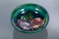 Lot 513 - MOORCROFT ORCHID BOWL on a blue green body...