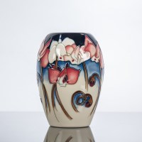 Lot 524 - MOORCROFT VASE with flag irises on a blue and...