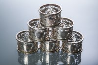 Lot 293 - SET OF SIX EDWARDIAN SILVER NAPKIN RINGS maker...